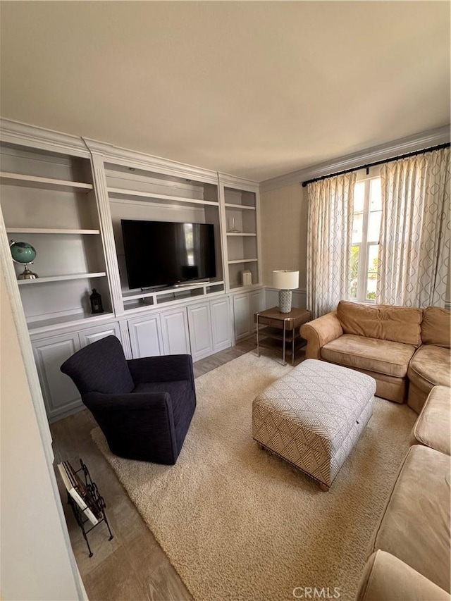 44 Arcata, Irvine, CA 92602 - living room featuring built in features, wood finished floors, and crown molding