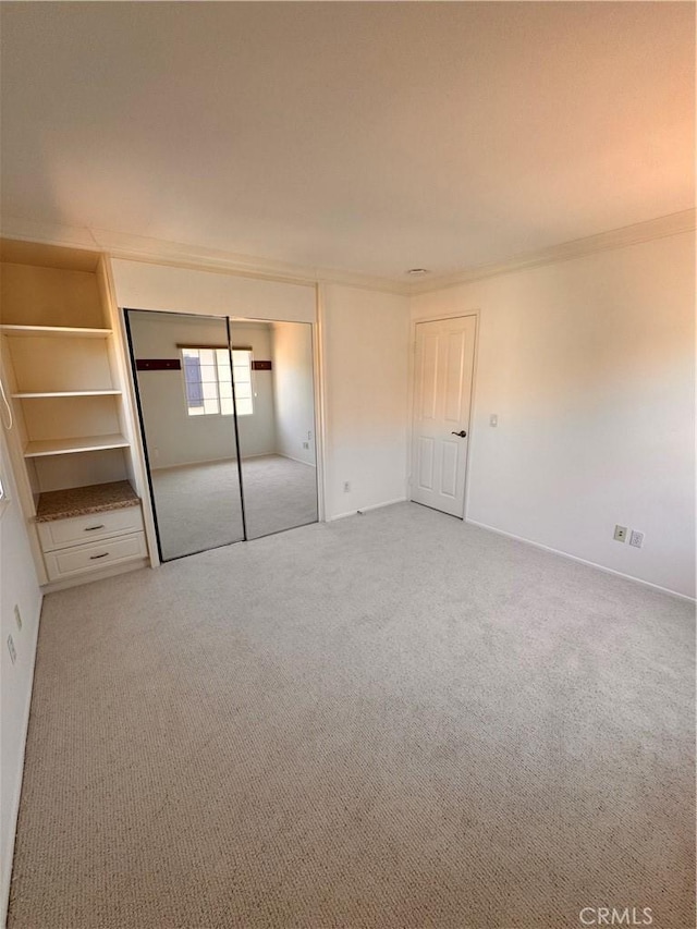44 Arcata, Irvine, CA 92602 - unfurnished bedroom with carpet, crown molding, and a closet