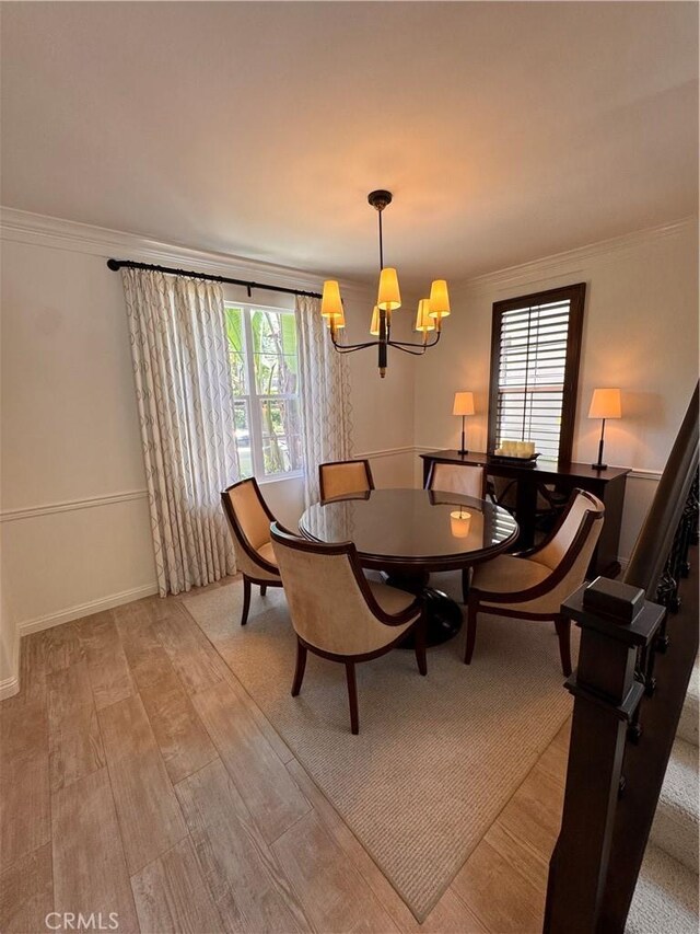 44 Arcata, Irvine, CA 92602 - dining space with a chandelier, crown molding, and light wood-style floors