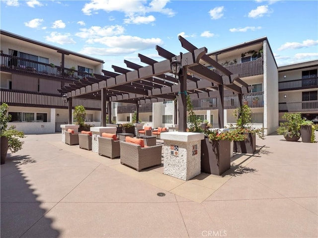 5334 Lindley Ave Unit 125, Encino, CA 91316 - view of patio / terrace featuring an outdoor living space and a pergola