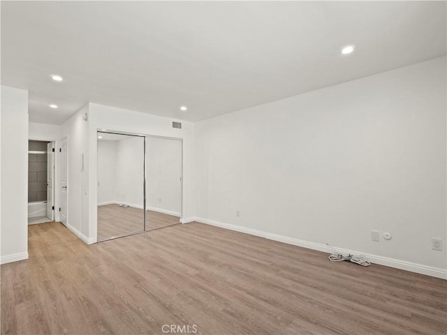 5334 Lindley Ave Unit 125, Encino, CA 91316 - unfurnished bedroom featuring wood finished floors, a closet, and recessed lighting