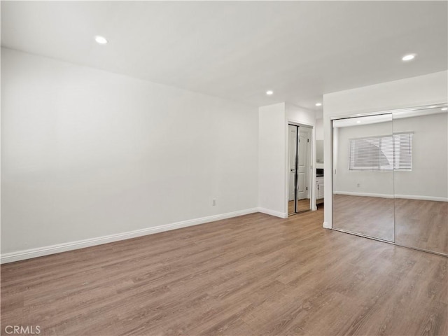 5334 Lindley Ave Unit 125, Encino, CA 91316 - unfurnished bedroom featuring wood finished floors and recessed lighting