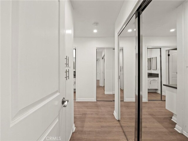 5334 Lindley Ave Unit 125, Encino, CA 91316 - hall with wood finished floors and recessed lighting