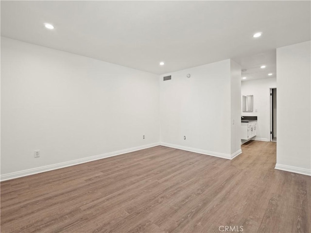 5334 Lindley Ave Unit 125, Encino, CA 91316 - unfurnished room featuring recessed lighting and wood finished floors