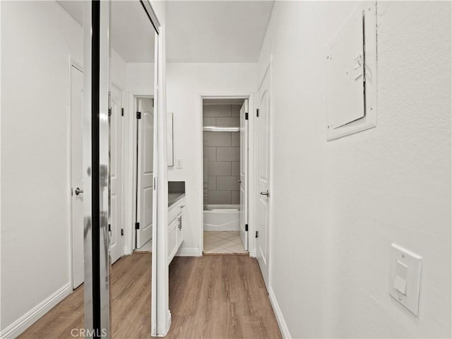 5334 Lindley Ave Unit 125, Encino, CA 91316 - hall with light wood-style flooring and baseboards
