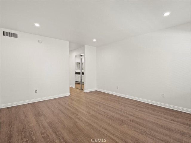 5334 Lindley Ave Unit 125, Encino, CA 91316 - unfurnished room with wood finished floors and recessed lighting