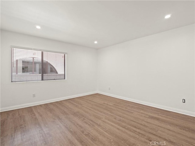 5334 Lindley Ave Unit 125, Encino, CA 91316 - unfurnished room featuring wood finished floors and recessed lighting