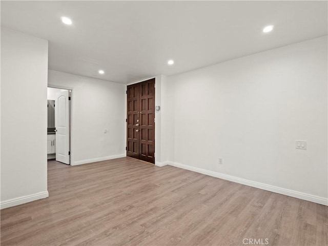 5334 Lindley Ave Unit 125, Encino, CA 91316 - unfurnished room featuring light wood-style floors and recessed lighting