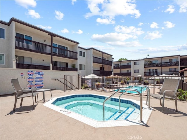 5334 Lindley Ave Unit 125, Encino, CA 91316 - view of swimming pool with a hot tub, a swimming pool, and a patio