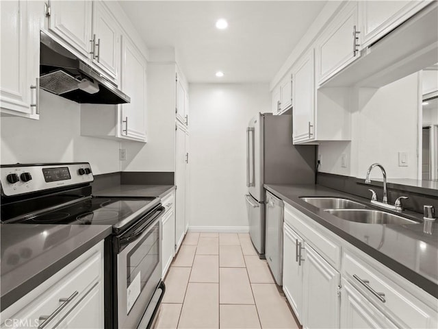 5334 Lindley Ave Unit 125, Encino, CA 91316 - kitchen featuring stainless steel appliances, under cabinet range hood, dark countertops, white cabinetry, and recessed lighting