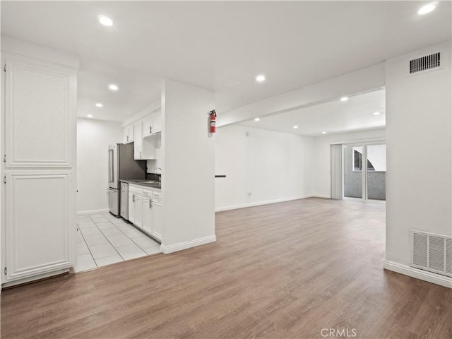 5334 Lindley Ave Unit 125, Encino, CA 91316 - unfurnished living room featuring light wood-style floors and recessed lighting