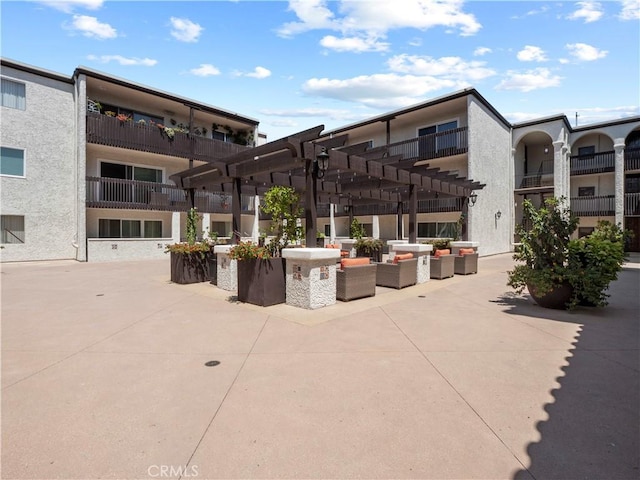 5334 Lindley Ave Unit 125, Encino, CA 91316 - view of property's community featuring an outdoor hangout area, a pergola, and a patio