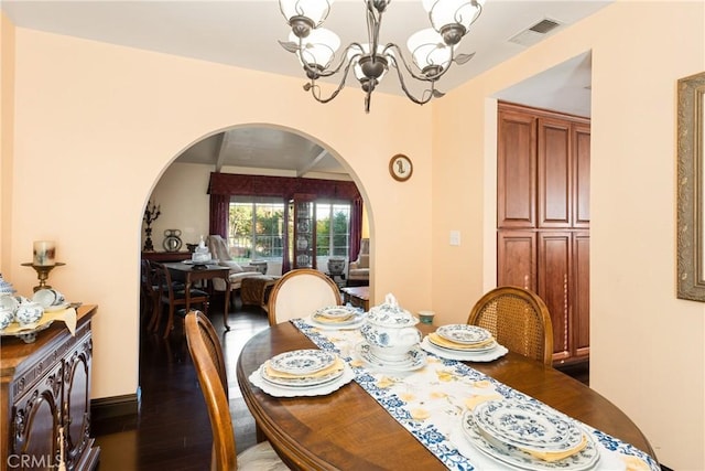 5266 Bluff St, Norco, CA 92860 - dining room with arched walkways, a chandelier, and dark wood-style floors