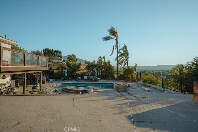 5266 Bluff St, Norco, CA 92860 - view of pool with a patio area, a mountain view, and a pool with connected hot tub