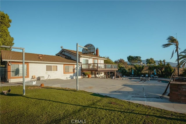 5266 Bluff St, Norco, CA 92860 - rear view of property with stucco siding, a patio, and a yard