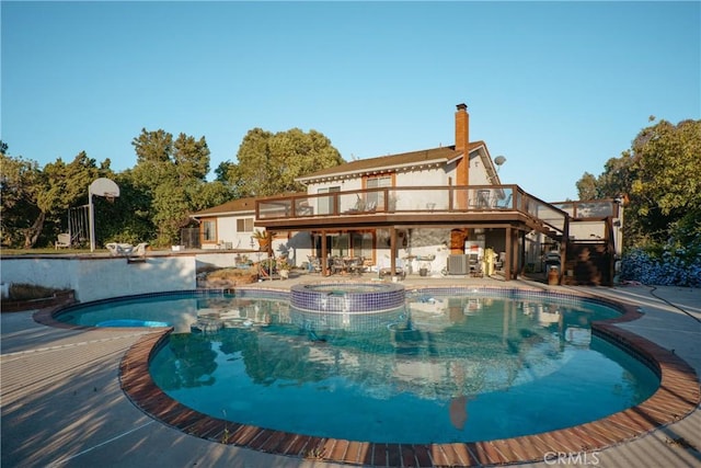 5266 Bluff St, Norco, CA 92860 - view of pool featuring stairs, a deck, a pool with connected hot tub, and a patio area