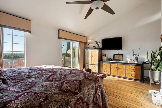 5266 Bluff St, Norco, CA 92860 - bedroom featuring access to exterior, multiple windows, light wood-style floors, vaulted ceiling, and ceiling fan