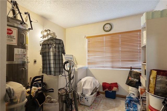5266 Bluff St, Norco, CA 92860 - interior space featuring a textured ceiling, electric water heater, and washer / dryer