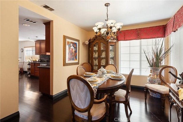 5266 Bluff St, Norco, CA 92860 - dining room with a chandelier and dark wood-style flooring