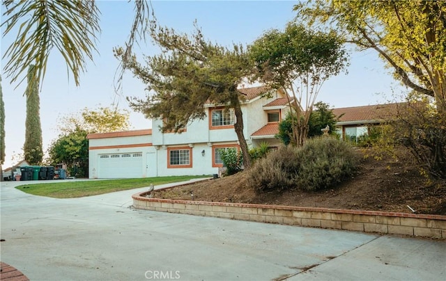 5266 Bluff St, Norco, CA 92860 - view of front of house featuring stucco siding, driveway, and a garage