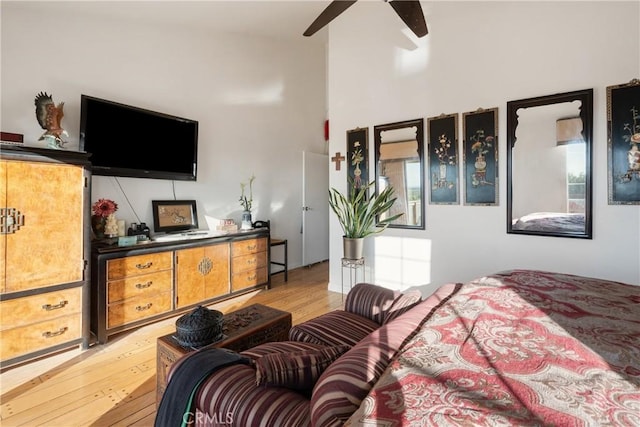5266 Bluff St, Norco, CA 92860 - bedroom with light wood-style floors, a towering ceiling, and a ceiling fan