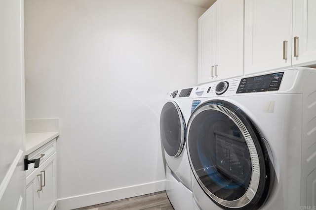 1506 Alvarado St, Oceanside, CA 92054 - laundry room featuring independent washer and dryer, cabinet space, and light wood-type flooring