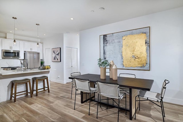 1506 Alvarado St, Oceanside, CA 92054 - dining room with light wood-style flooring and recessed lighting
