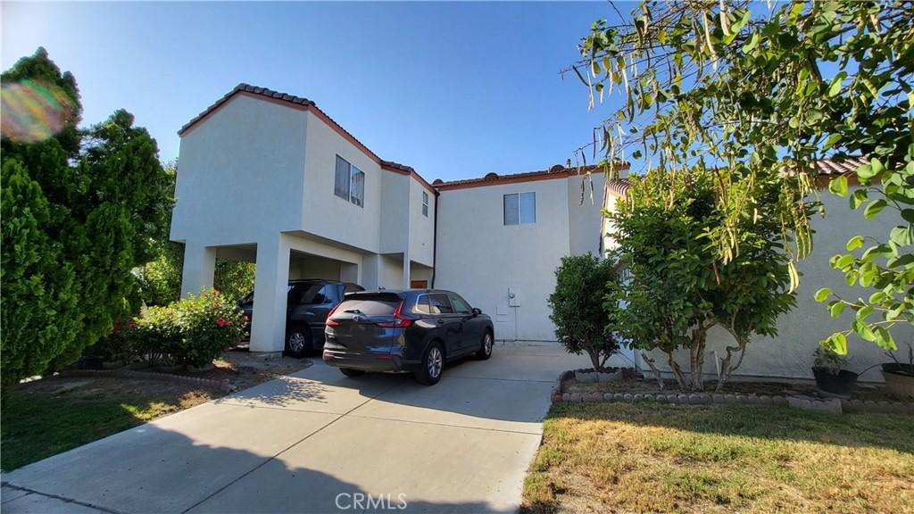 11495 Whittier Ave, Loma Linda, CA 92354 - view of front of home with driveway and stucco siding