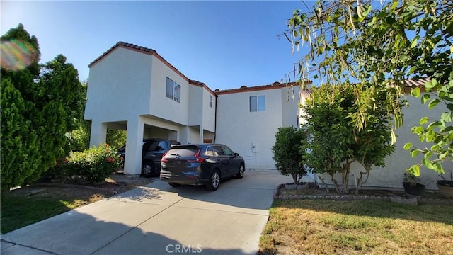 11495 Whittier Ave, Loma Linda, CA 92354 - view of front of home with driveway and stucco siding