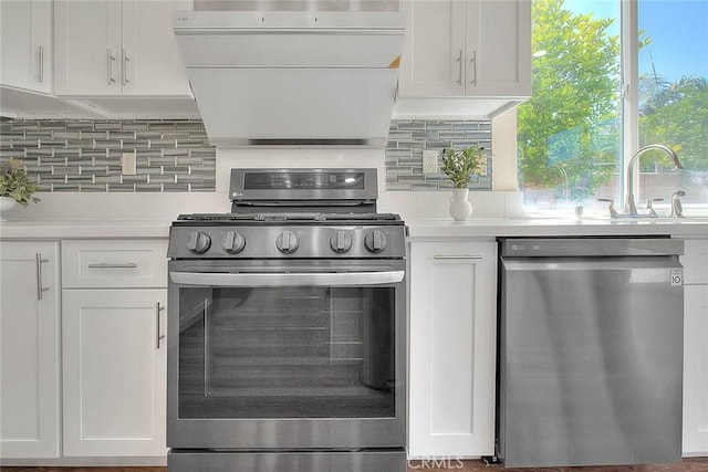 149 E Saint Andrews St, Ontario, CA 91761 - kitchen featuring stainless steel appliances, light countertops, tasteful backsplash, and white cabinetry