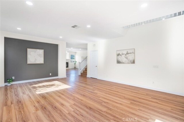 149 E Saint Andrews St, Ontario, CA 91761 - spare room with light wood-style floors, stairs, and recessed lighting