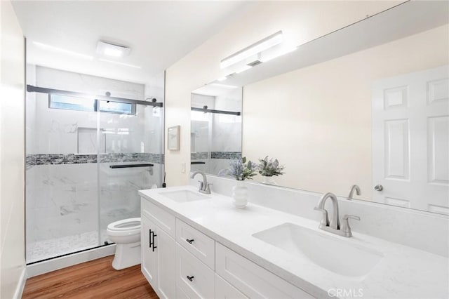 149 E Saint Andrews St, Ontario, CA 91761 - full bath featuring double vanity, a marble finish shower, and wood finished floors