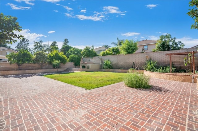 149 E Saint Andrews St, Ontario, CA 91761 - fenced backyard with a patio area