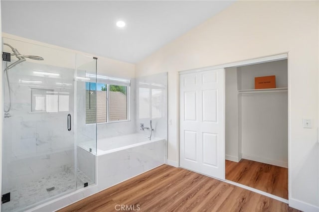 149 E Saint Andrews St, Ontario, CA 91761 - bathroom featuring a marble finish shower, a bath, vaulted ceiling, and wood finished floors