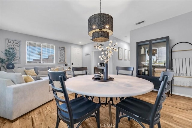 31164 Twilight Vista Dr, Menifee, CA 92584 - dining room with a chandelier and light wood-style floors