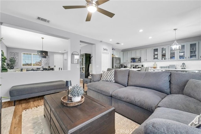 31164 Twilight Vista Dr, Menifee, CA 92584 - living area featuring a ceiling fan, light wood-type flooring, and recessed lighting