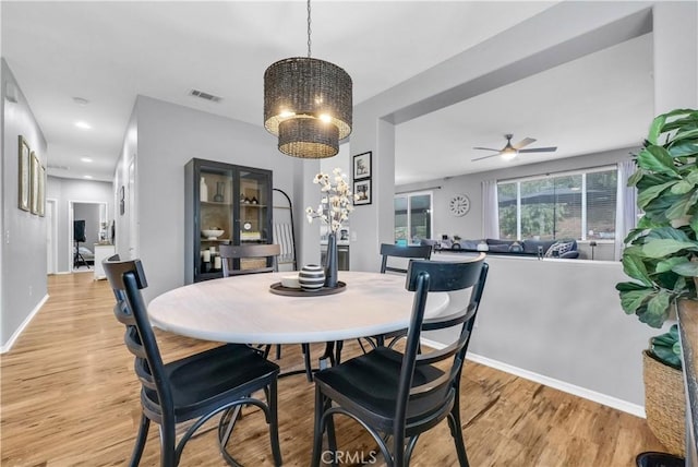 31164 Twilight Vista Dr, Menifee, CA 92584 - dining area featuring a chandelier, light wood finished floors, and a ceiling fan