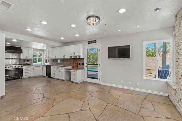 1200 Cerca, San Clemente, CA 92673 - kitchen featuring stainless steel range, wall chimney range hood, black dishwasher, decorative backsplash, and white cabinets