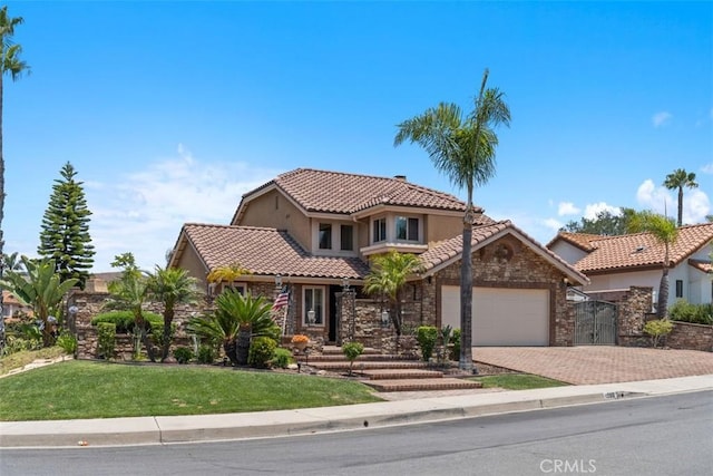 1200 Cerca, San Clemente, CA 92673 - mediterranean / spanish-style house featuring a garage, a tile roof, a front yard, stucco siding, and driveway