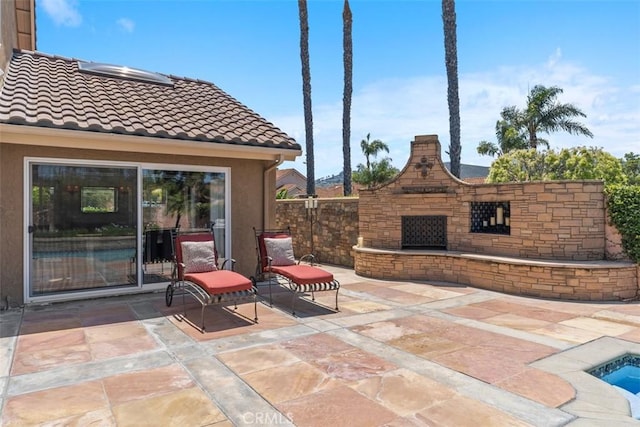 1200 Cerca, San Clemente, CA 92673 - view of patio / terrace featuring an outdoor stone fireplace