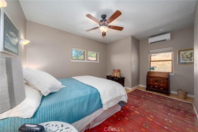 3165 Keeling Ave, Lakeport, CA 95453 - bedroom featuring multiple windows, a wall unit AC, wood finished floors, and ceiling fan