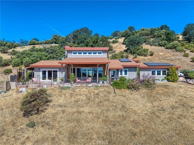 3165 Keeling Ave, Lakeport, CA 95453 - rear view of property featuring solar panels, a chimney, and a shingled roof