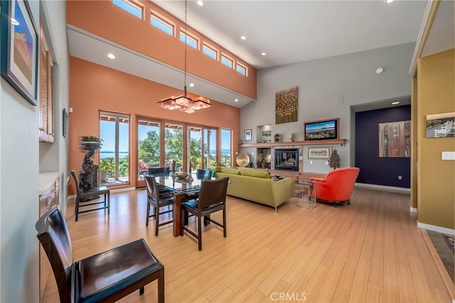 3165 Keeling Ave, Lakeport, CA 95453 - dining space featuring light wood-style floors, a chandelier, a high ceiling, and recessed lighting