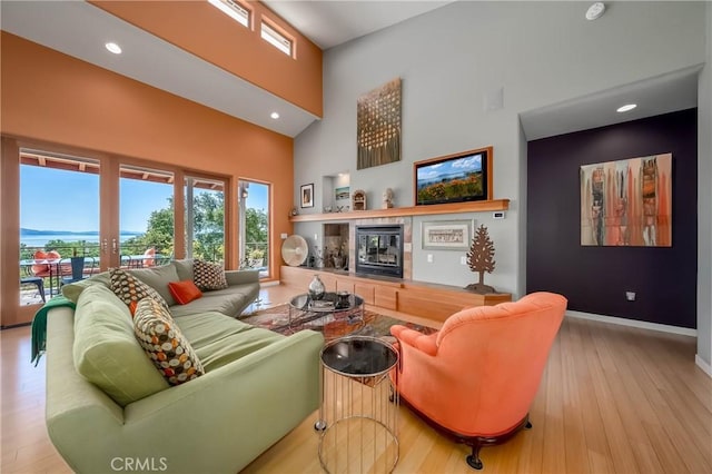 3165 Keeling Ave, Lakeport, CA 95453 - living area with a towering ceiling, wood finished floors, recessed lighting, and a tile fireplace