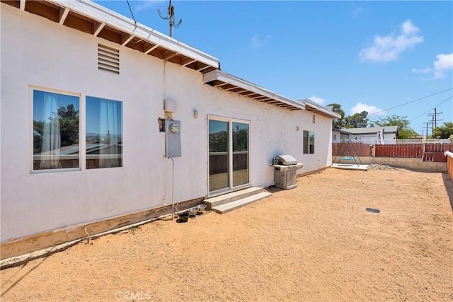 23859 S Rd, Apple Valley, CA 92307 - back of property with a fenced backyard and stucco siding
