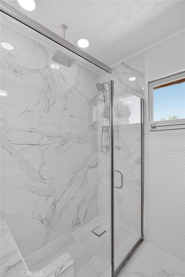 23859 S Rd, Apple Valley, CA 92307 - full bathroom with a marble finish shower, a textured ceiling, marble finish flooring, and ornamental molding