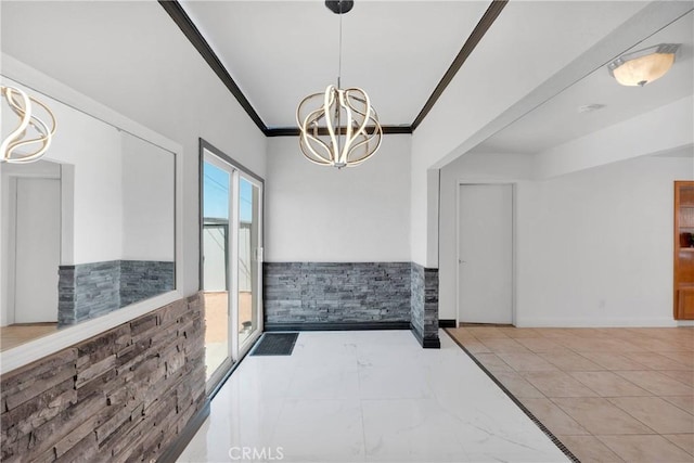 23859 S Rd, Apple Valley, CA 92307 - unfurnished dining area with a chandelier, ornamental molding, and a wainscoted wall