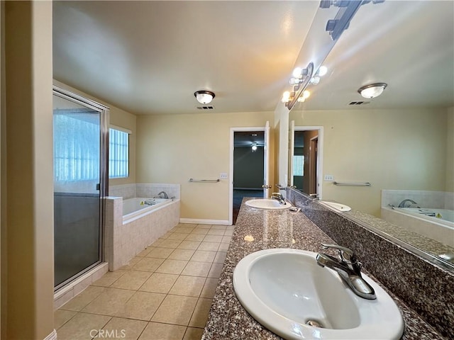606 W Grand Ave, Pomona, CA 91766 - bathroom featuring a bath, tile patterned flooring, double vanity, and a stall shower