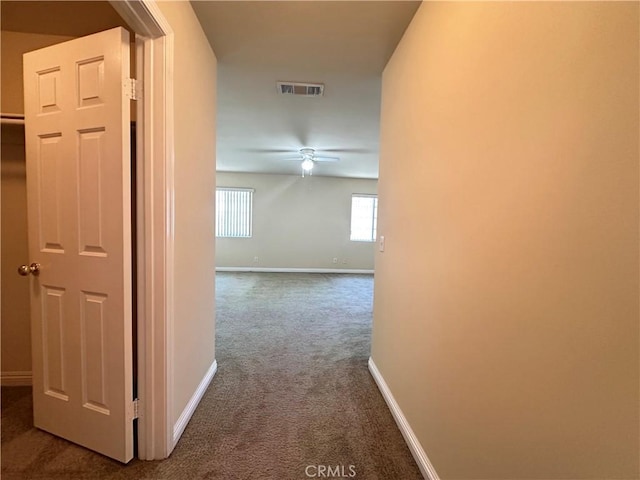 606 W Grand Ave, Pomona, CA 91766 - corridor featuring dark carpet and baseboards