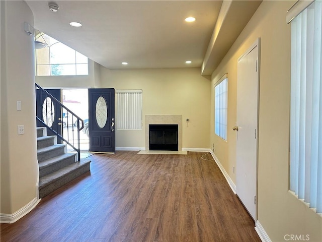 606 W Grand Ave, Pomona, CA 91766 - foyer entrance featuring wood finished floors, recessed lighting, stairway, and a fireplace
